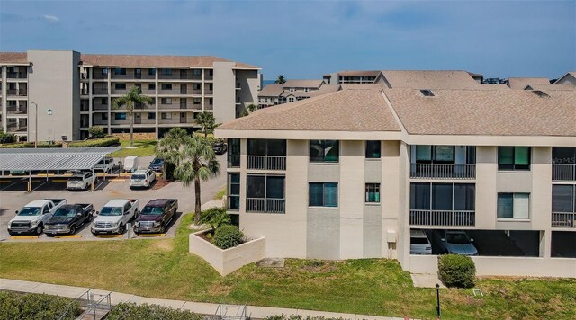 8210 Aquila St Unit 218, Port Richey, FL 34668 - view of building exterior featuring uncovered parking