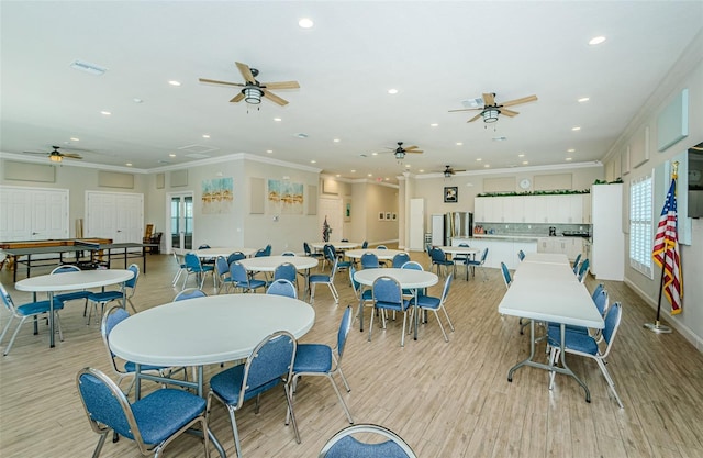 8210 Aquila St Unit 218, Port Richey, FL 34668 - dining room with recessed lighting, ornamental molding, ceiling fan, light wood finished floors, and baseboards
