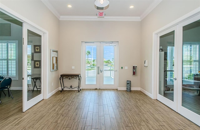 8210 Aquila St Unit 218, Port Richey, FL 34668 - entryway featuring french doors, light wood-type flooring, crown molding, baseboards, and recessed lighting