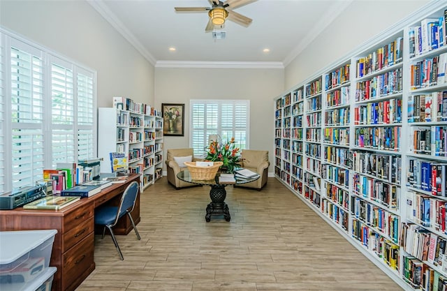 8210 Aquila St Unit 218, Port Richey, FL 34668 - home office featuring bookshelves, wood finished floors, crown molding, a ceiling fan, and recessed lighting