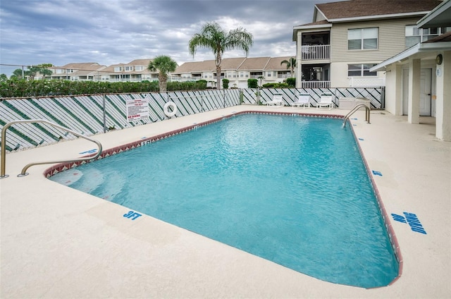 8210 Aquila St Unit 218, Port Richey, FL 34668 - community pool featuring a residential view, fence, and a patio