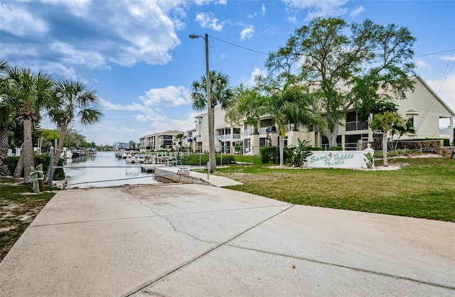 8210 Aquila St Unit 218, Port Richey, FL 34668 - view of home's community with a water view, a yard, and a residential view