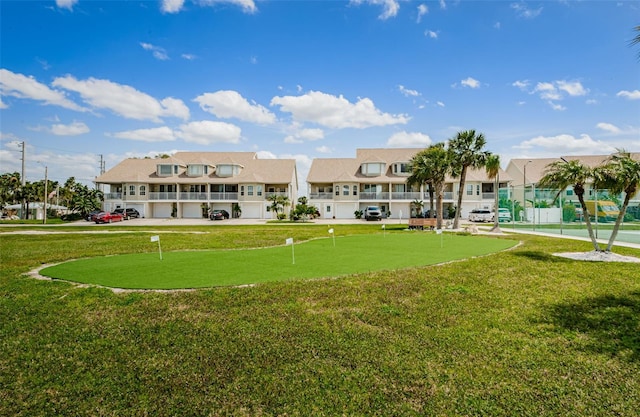 8210 Aquila St Unit 218, Port Richey, FL 34668 - view of home's community with a putting area, a residential view, and a lawn