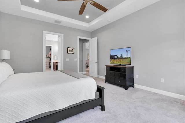 bedroom with visible vents, recessed lighting, baseboards, and a tray ceiling