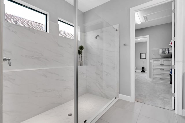 full bath with baseboards and a marble finish shower