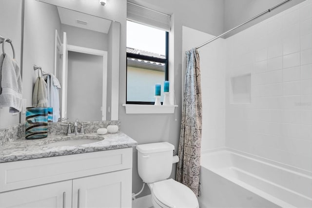 full bath with toilet, visible vents, shower / bath combo, and vanity