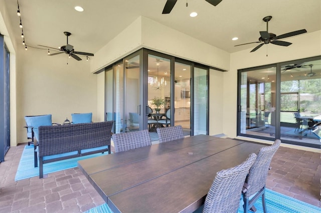 view of patio / terrace with outdoor dining space and ceiling fan