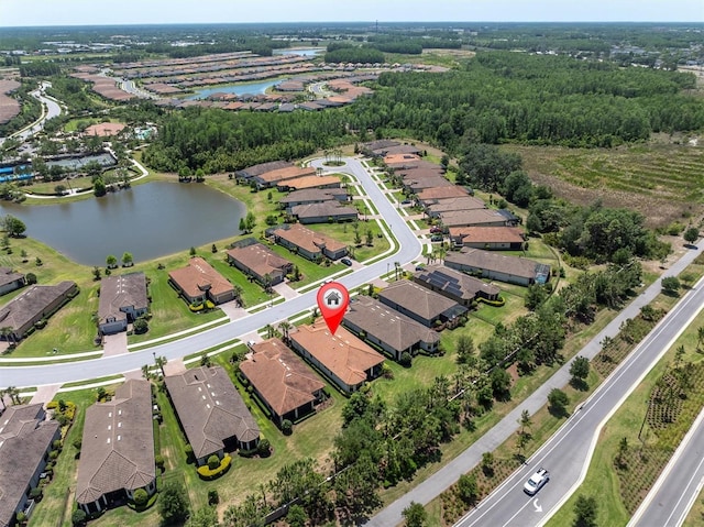 birds eye view of property with a water view and a residential view