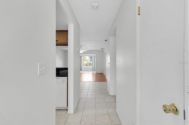 corridor with light tile patterned floors