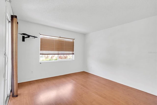 empty room with wood finished floors