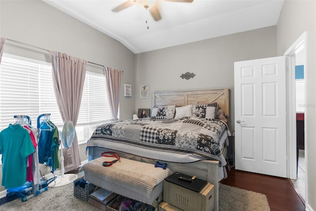 bedroom featuring ceiling fan, vaulted ceiling, and wood finished floors