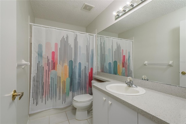full bathroom featuring a textured ceiling, visible vents, tile patterned floors, vanity, and toilet