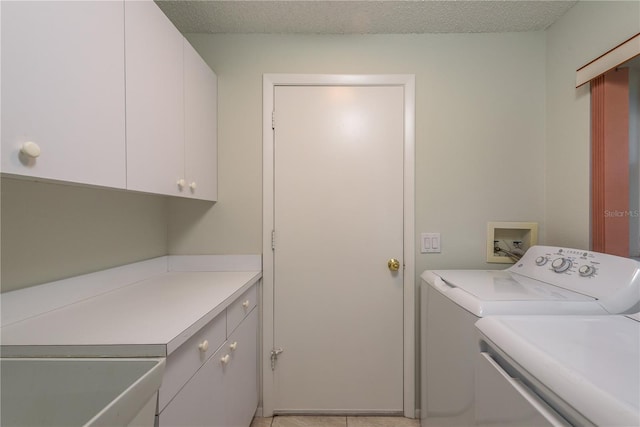 laundry area featuring cabinet space and washer and clothes dryer
