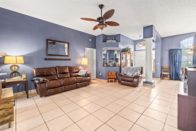 12040 Penzance Ln, New Port Richey, FL 34654 - living area with a textured ceiling, decorative columns, ceiling fan, and light tile patterned flooring