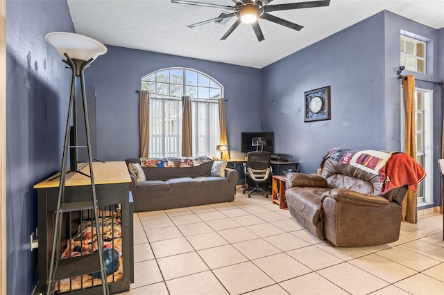 12040 Penzance Ln, New Port Richey, FL 34654 - living area with tile patterned flooring, a ceiling fan, and a textured ceiling