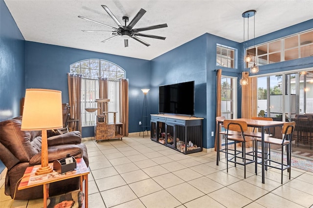 12040 Penzance Ln, New Port Richey, FL 34654 - living room featuring plenty of natural light, ceiling fan, and tile patterned floors