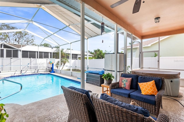 12040 Penzance Ln, New Port Richey, FL 34654 - view of pool with a hot tub, a patio area, a fenced backyard, a ceiling fan, and glass enclosure