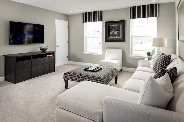 living room with carpet flooring, recessed lighting, baseboards, and a wealth of natural light