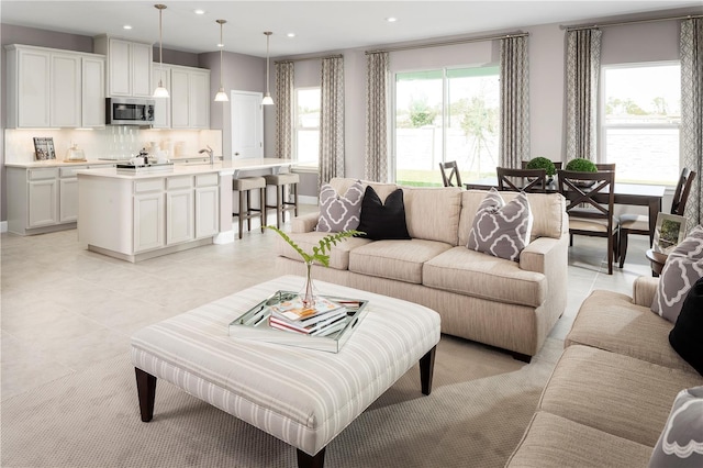 living room featuring light tile patterned floors and recessed lighting