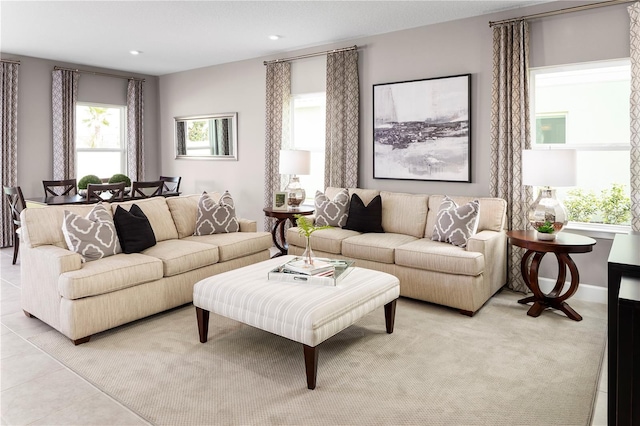 living room featuring recessed lighting, baseboards, and light tile patterned floors