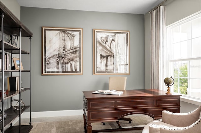 office space with baseboards