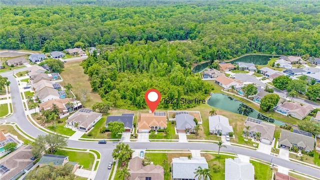 7827 Starfire Way, New Port Richey, FL 34654 - view of property location featuring a forest, nearby suburban area, and a large body of water