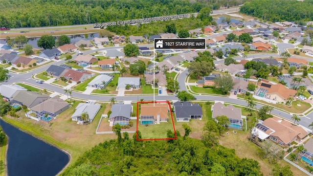 7827 Starfire Way, New Port Richey, FL 34654 - aerial view of residential area featuring a nearby body of water and property parcel outlined