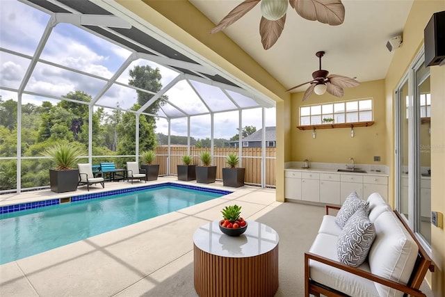7827 Starfire Way, New Port Richey, FL 34654 - view of pool featuring a patio area, outdoor lounge area, ceiling fan, and glass enclosure