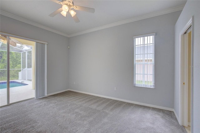 7827 Starfire Way, New Port Richey, FL 34654 - carpeted spare room with crown molding, baseboards, and a ceiling fan
