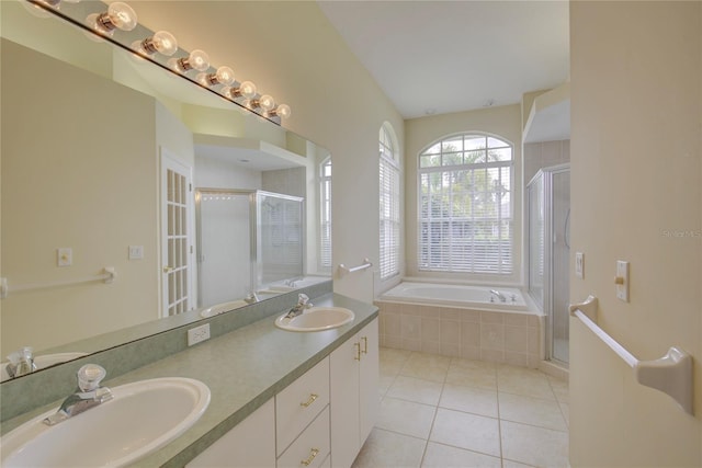 7827 Starfire Way, New Port Richey, FL 34654 - full bath featuring tile patterned floors, a shower stall, a bath, and double vanity