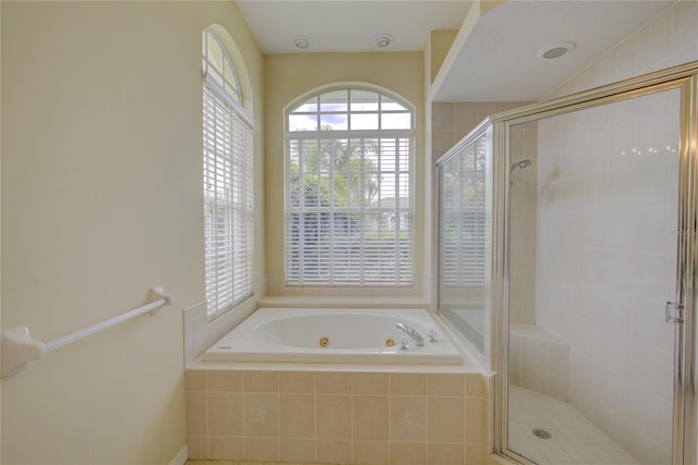 7827 Starfire Way, New Port Richey, FL 34654 - full bathroom with a whirlpool tub and a stall shower