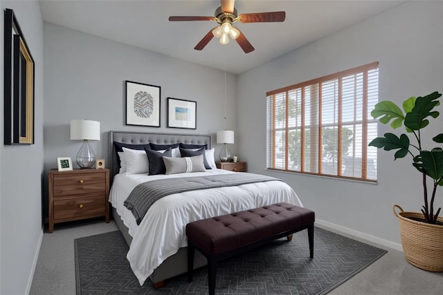 7827 Starfire Way, New Port Richey, FL 34654 - bedroom featuring carpet flooring, multiple windows, baseboards, and ceiling fan