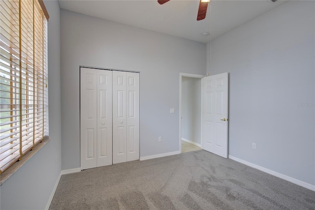 7827 Starfire Way, New Port Richey, FL 34654 - unfurnished bedroom with carpet floors, baseboards, a closet, and ceiling fan