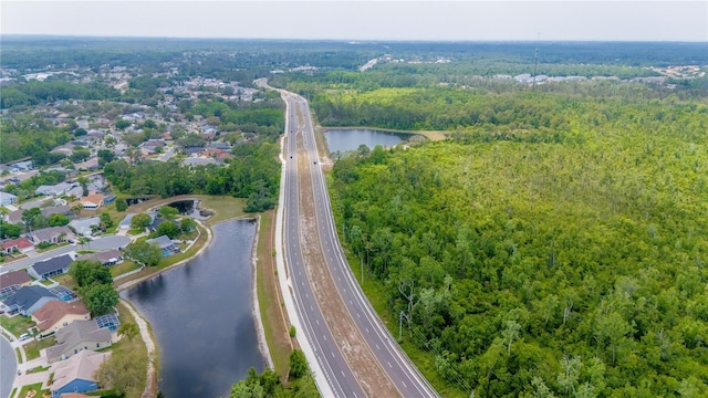 7827 Starfire Way, New Port Richey, FL 34654 - aerial view of property's location with a highway, a large body of water, a heavily wooded area, and nearby suburban area