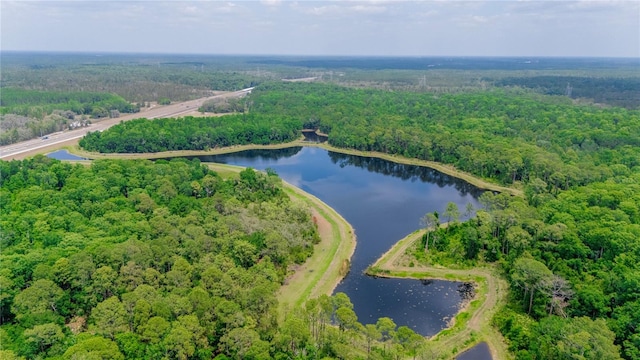 7827 Starfire Way, New Port Richey, FL 34654 - aerial view of property and surrounding area with a heavily wooded area and a nearby body of water
