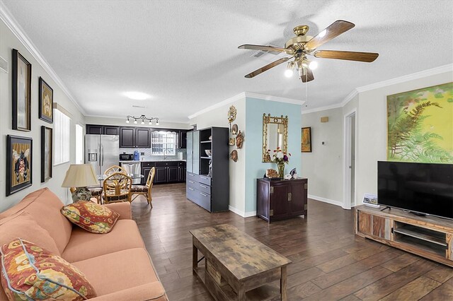 6219 Wilds Dr Unit 11A, New Port Richey, FL 34653 - living room featuring ornamental molding, dark wood-style floors, a textured ceiling, ceiling fan, and baseboards