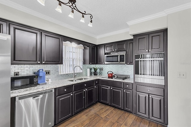 6219 Wilds Dr Unit 11A, New Port Richey, FL 34653 - kitchen with black appliances, a sink, dark wood-type flooring, light stone counters, and tasteful backsplash
