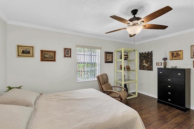 6219 Wilds Dr Unit 11A, New Port Richey, FL 34653 - bedroom with dark wood finished floors, crown molding, a textured ceiling, baseboards, and ceiling fan