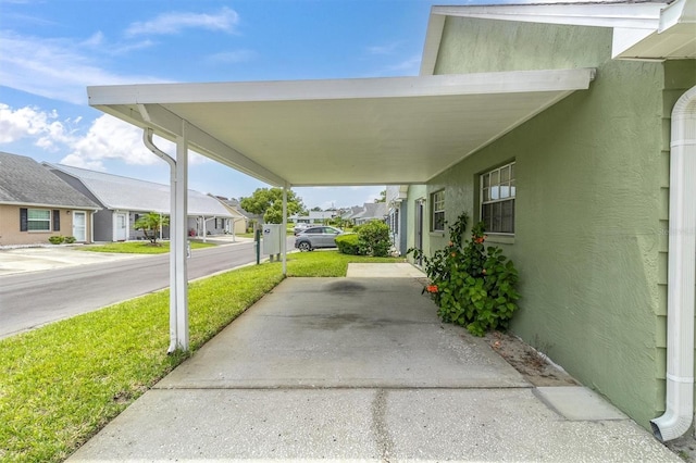 6219 Wilds Dr Unit 11A, New Port Richey, FL 34653 - view of patio / terrace featuring a residential view and a carport