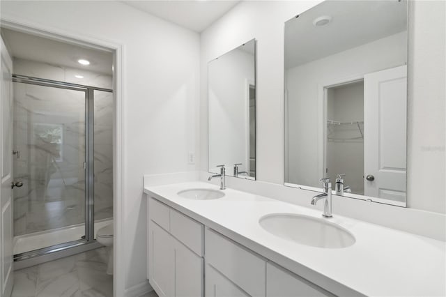 5240 Luisa Ct, Saint Cloud, FL 34771 - bathroom featuring marble look tile flooring, a marble finish shower, toilet, double vanity, and recessed lighting