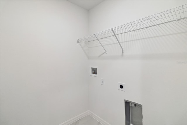 5240 Luisa Ct, Saint Cloud, FL 34771 - washroom with electric dryer hookup, hookup for a washing machine, baseboards, and marble finish flooring