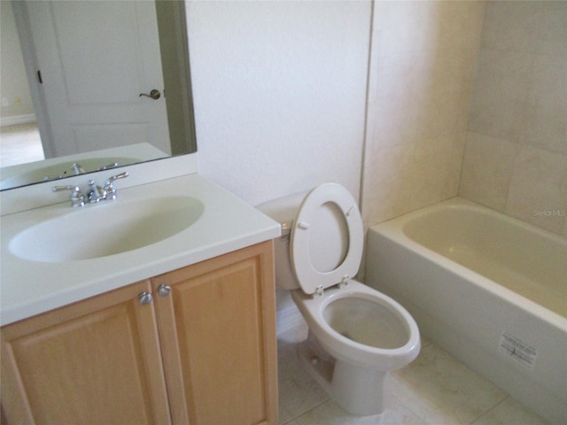 full bath with toilet, tile patterned floors, and vanity