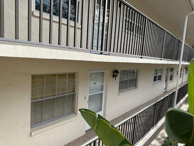 840 Virginia St Unit 202, Dunedin, FL 34698 - exterior space featuring stucco siding and a balcony