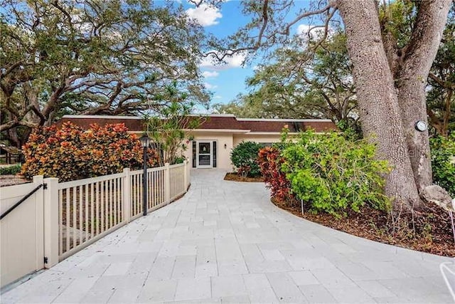 840 Virginia St Unit 202, Dunedin, FL 34698 - view of front of home with fence and stucco siding