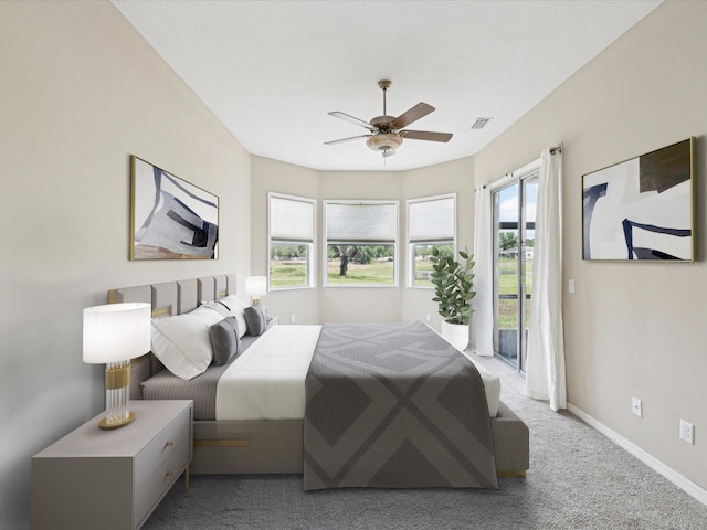carpeted bedroom featuring visible vents, baseboards, access to exterior, and ceiling fan