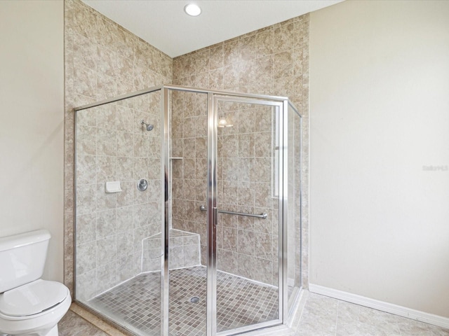 bathroom featuring toilet, recessed lighting, a stall shower, tile patterned floors, and baseboards
