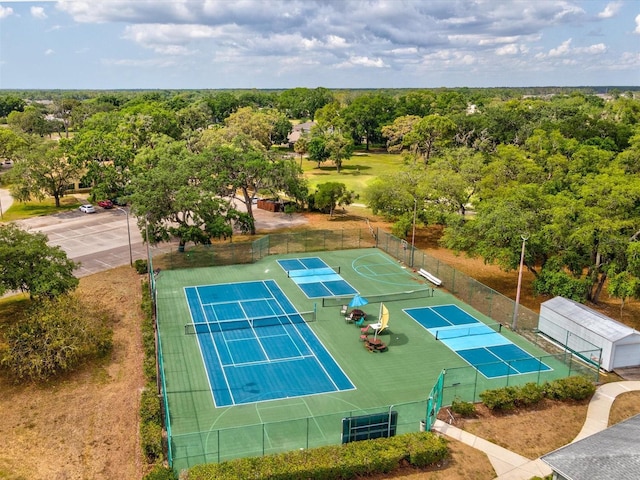 view of sport court featuring fence