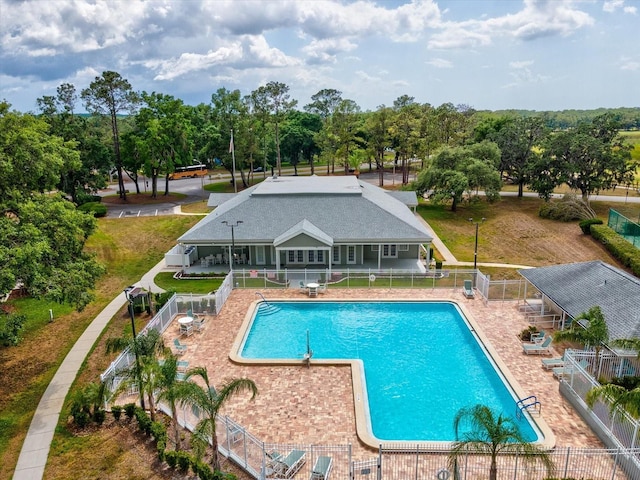 community pool featuring fence