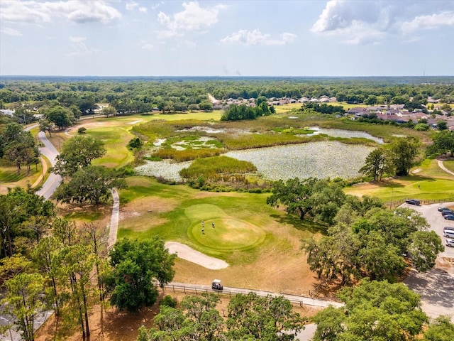 aerial view featuring a water view and view of golf course