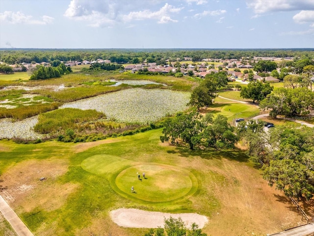 bird's eye view featuring a water view, golf course view, and a residential view